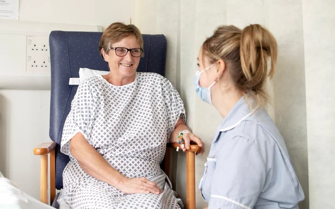 A picture of a nurse with a patient pre-op.