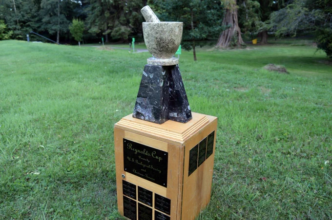 Image of the Reynolds Cup trophy sitting on its box in the grounds of The James Hutton Institute in 2018. 