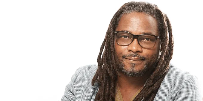Portrait of acclaimed filmmaker Biyi Bandele against a white background
