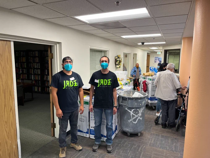 APANO volunteers helping install AC units 