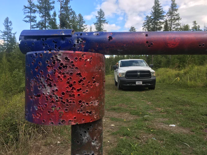 A gate that has been used for target practice in the Northern Region.