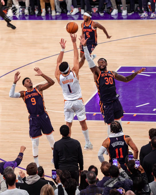 Devin Booker shoots basketball