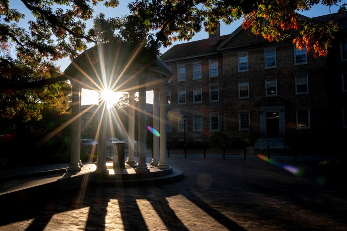 The sun shines through the Old Well on an autumn day.