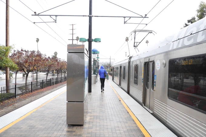 Metro Rail platform and train on a rainy day