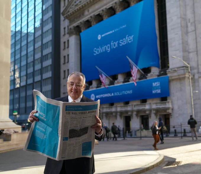 Greg Brown, Chairman and CEO, #MotorolaSolutions reads the Wall Street Journal in front of the New York Stock Exchange 