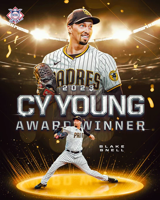 2023 NL Cy Young Award Winner: Blake Snell
Pictured: Two cutouts of Snell, one smiling and one mid-pitch in a home white Padres uniform with brown and yellow lettering. He is pictured in front of a stadium with yellow lights surrounding him.
