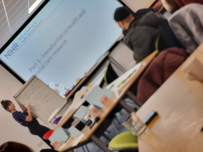 Presenter introducing VCS Community champions to health and social care research at training workshop