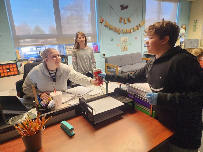 Student delivering coffee