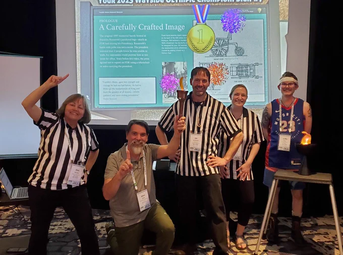 Glenn Klaus and fellow NAI members pose with the Wayside Olympics trophy.