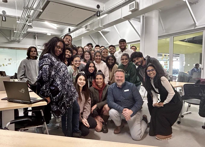 Photo of students meeting Melis Burkay. 