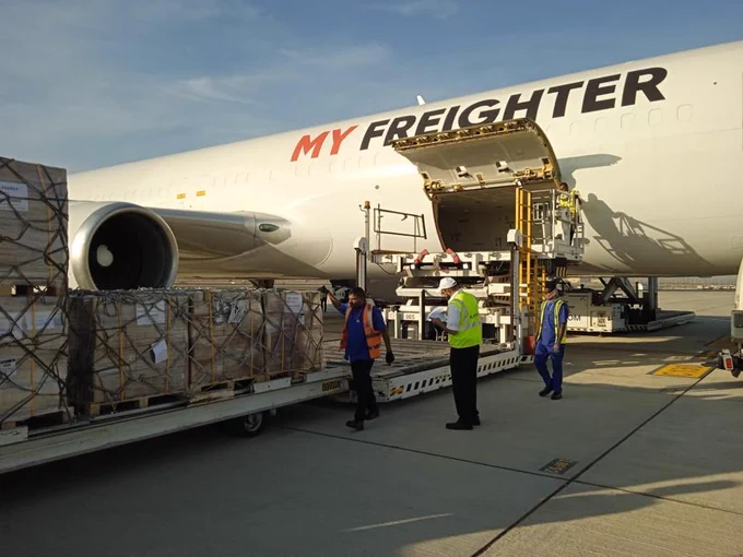 Crates of USAID nutritional food aid to be loaded onto planes.