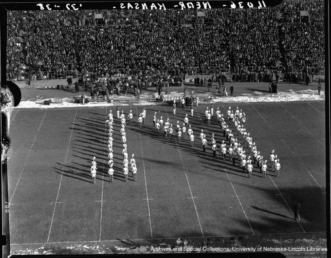 The band forms an N on the field during a game against Kansas