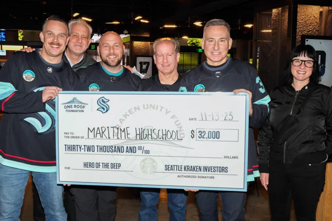 The captain and crew of the King County Water Taxi Doc Maynard with Seattle Kraken President Tod Leiweke and King County Executive Dow Constantine with the Kraken's contribution to the Highline Public Schools Maritime High School (l-r) Deckhand Nick Williams, Tod Leiweke, Deckhand Cory Bantam, Capt. Dan Krehbiel, Executive Constantine, Starbucks Senior Manager June Ashley