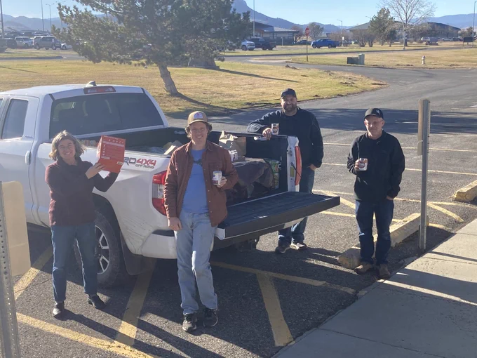 Team members load of the rig with canned goods before heading into downtown for drop off