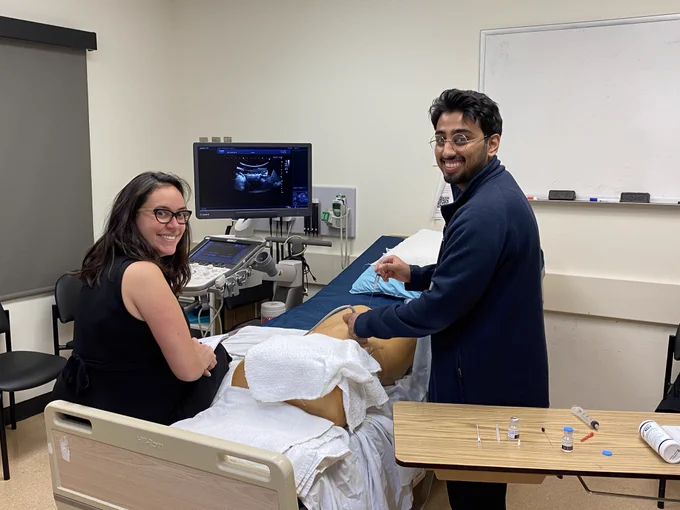 PGY-2 resident Arbaaz performing an ultrasound-guided paracentesis with Dr. Larocque. 