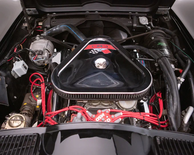 This custom 1967 Chevrolet Corvette started life as a factory air-conditioned convertible and since has benefited from a professional, Jerry Clark frame-off restoration with drivetrain. Power comes from a 454ci big-block engine bored 0.30 and stroked to 489ci and equipped with Tri-Power carburetion, Air Flow Research aluminum heads, a Lunati built and balanced rotating assembly, Lunati hydraulic roller cam and MSD ignition. The engine makes a dyno-tested 655hp with 590 ft./lbs of torque. The engine is mated to a Keisler 5-speed manual transmission. Spent gases exit through a set of Hedman headers with a side-pipe exhaust. Other upgrades include stainless-steel brake lines, oversized half-shafts, oversized calipers, heavy-duty sway bars, high-performance shocks and Dynamat heat- and sound-deadening. The exterior bodywork and paint were done by renowned J&M Corvette Auto Body in Brooksvill, FL. 