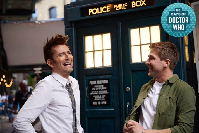 David Tennant and Steffan Powell laughing in front of the TARDIS on the set of Doctor Who: Unleashed