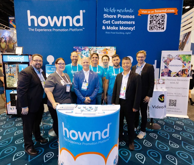 This is a group photo with the Hownd team and IAAPA leadership in front of the Hownd booth.