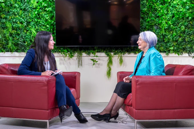 Governor General Mary Simon talks to a reporter on a talk show set.
