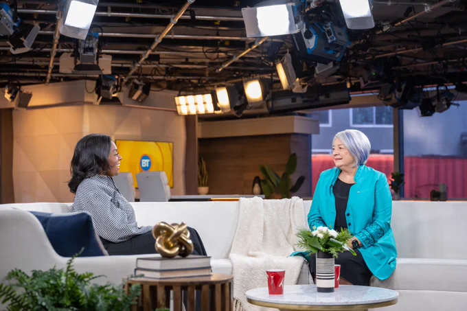 Governor General Mary Simon talks to a reporter on a talk show set.