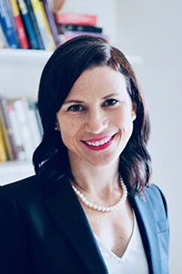 Headshot of Jessica Pac inside wearing black blazer and white shirt.
