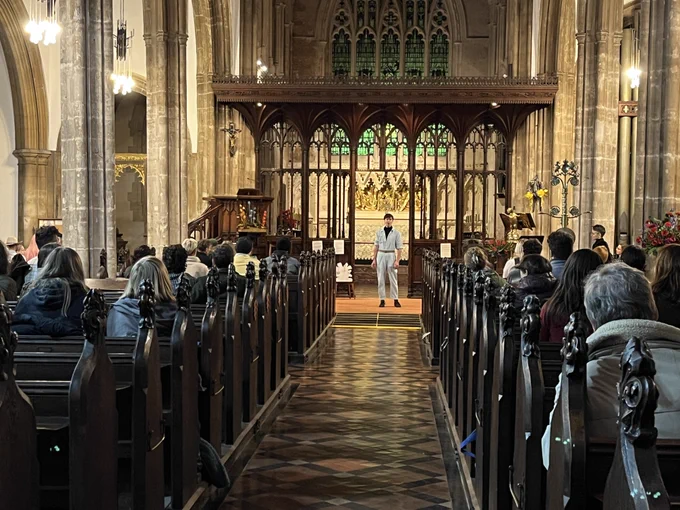 Audience and performer at St John's
