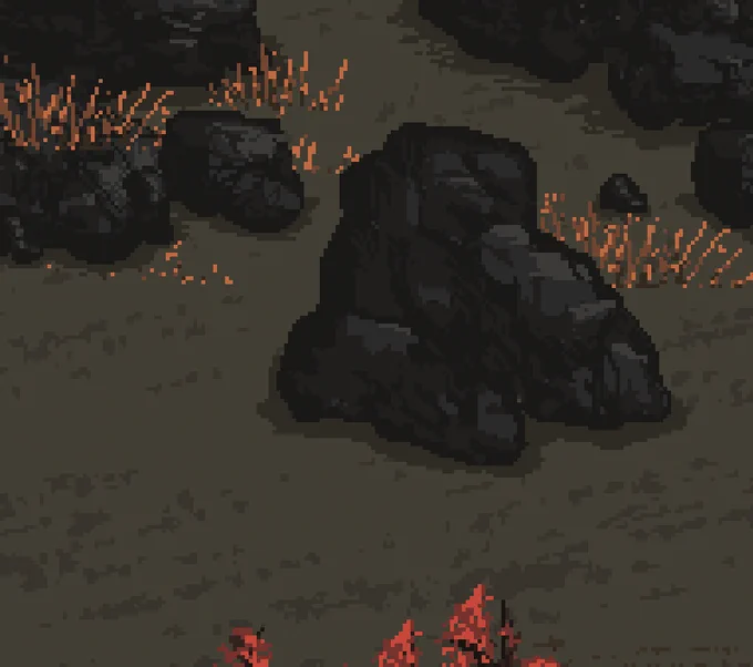 A self drawn rock in pixelart. Coloured in black and 3 shades of grey.