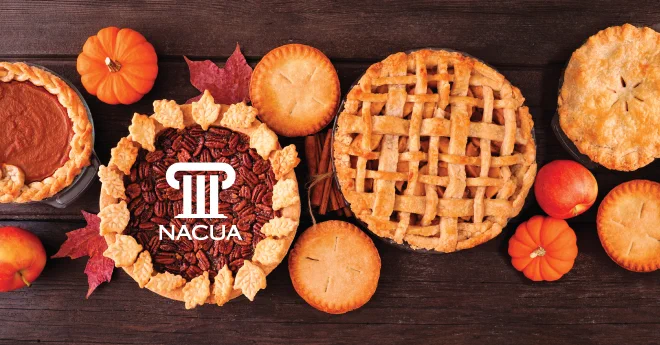 An assortment of pies on a table with apples and pumpkins. 