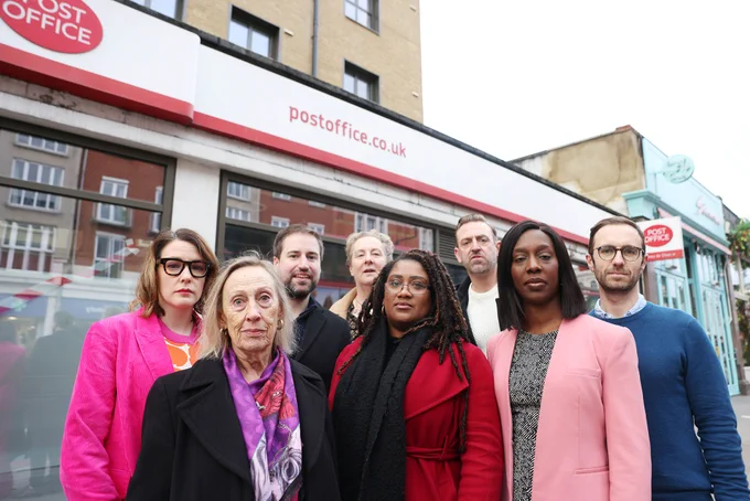 Bell stands outside Clapham Common Post Office with Florence Eshalomi MP and local Labour Councillors for Clapham Common, Clapham East, and Clapham Town.