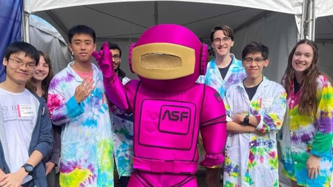 ChEmory chapter members pose at the Atlanta Science Festival with the ASF mascot, a robot in a hot pink suit