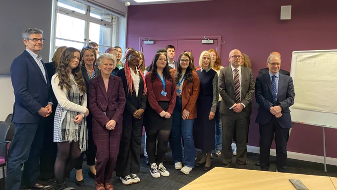 MSYPs and Scottish Government staff standing together smiling at the camera
