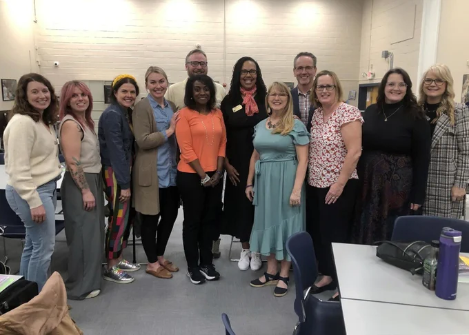 Rockwood staff members smile during a group training session. 