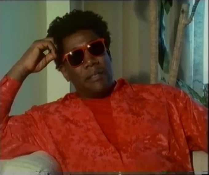 Clarence Clemons interviewed by David Hepworth for the BBC. Looking awesome in bright orange and shades.
