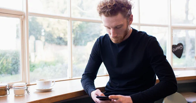 man looking at phone