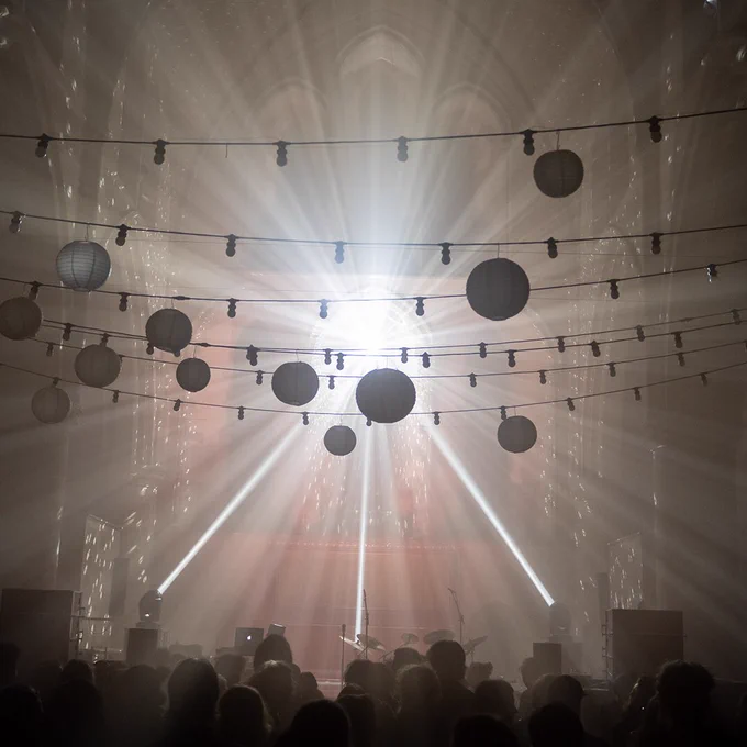 A crowd gather to watch the light show at Left Bank Leeds