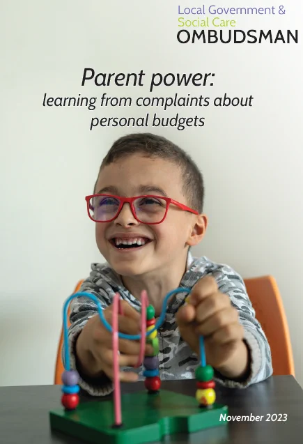 Front cover of report showing young boy playing with bead game