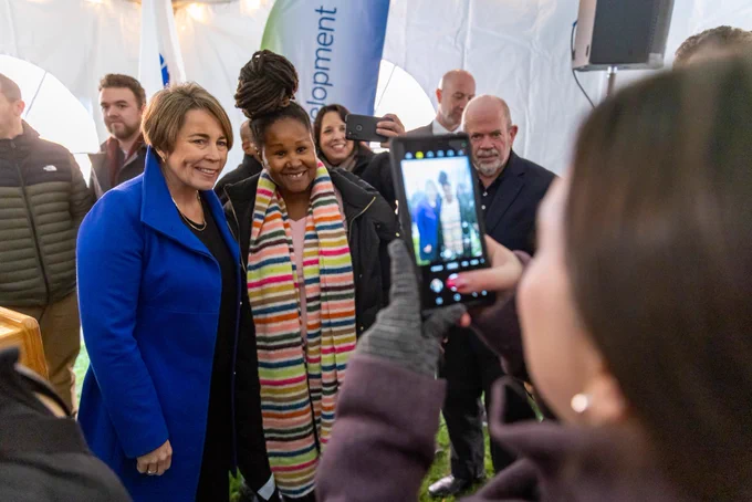 Governor Healey taking selfie with woman.