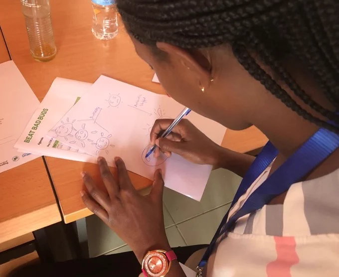 A person writing on a piece of paper