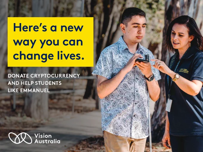 Text reading donate cryptocurrency and help students like Emmanuel next to an image of Emmanuel using his phone while being guided by a Vision Australia staff member.