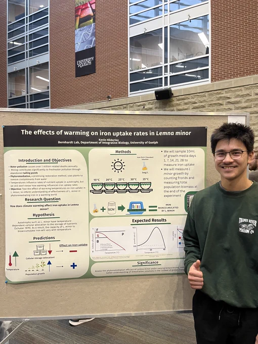 Photo of Kevin Hilderley not to his poster titled " The effects of warming on iron uptake rates in Lemna minor"