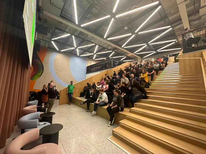 NUX crowd in the auditorium listening to Colin and Jess from Code deliver their talk on Design leadership.