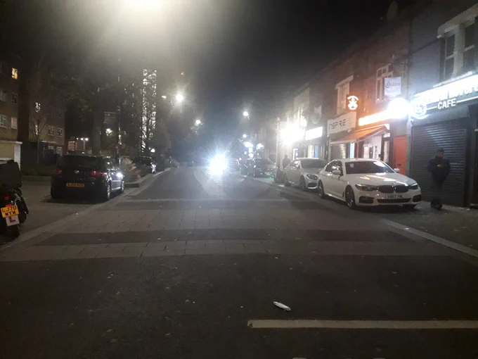 Cars on both pavements on both sides of the road