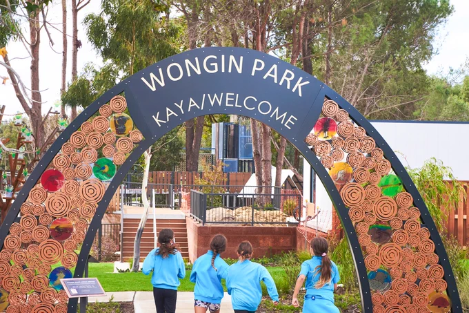 Wongin Park entry sign and kids running