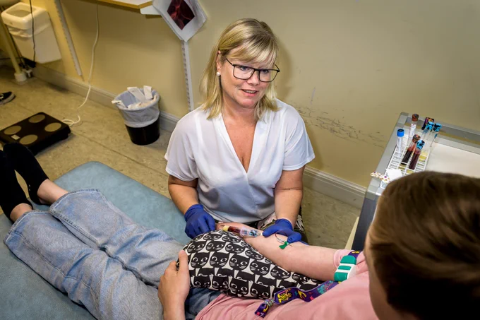 Children taking part in the TEDDY study in Sweden have an increased risk of developing type 1 diabetes and are screened for the disease. Research nurse Jessica Melin takes a blood sample from one of the participants. Photograph: Kennet Ruona