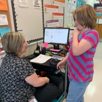 Teacher and student engaging in data talk at Maury Middle School.