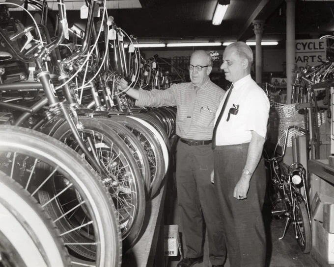 Joseph J. Fridrich (right) talks with longtime employee Fred Kidd as they look at new bicycles inside the store in 1968. Photo: Cleveland Public Library, Photograph Collection