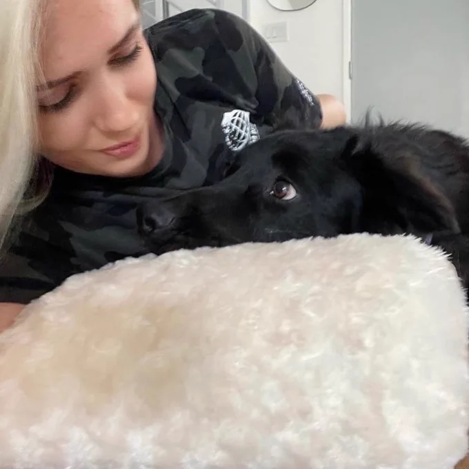 A picture of me and the dog staring at each other