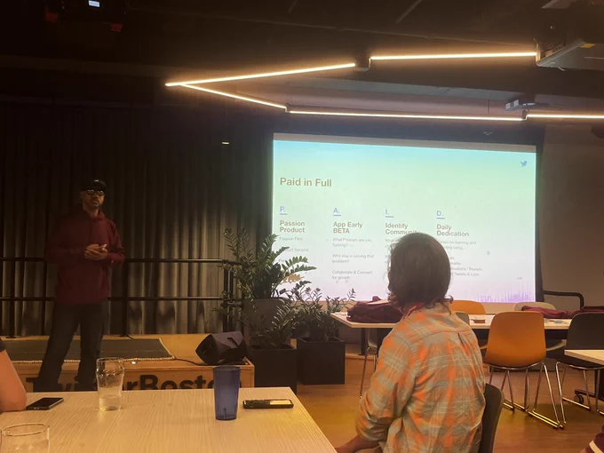 Joselin presents his P.A.I.D. slide at Twitter Dev Boston Tweetup