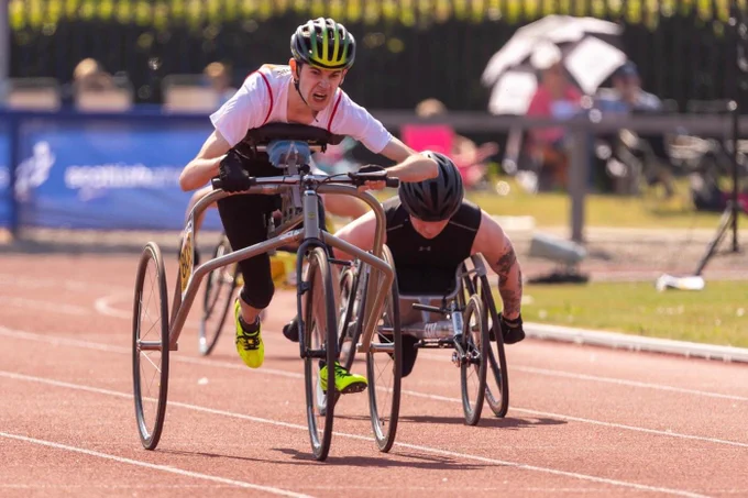 Photo of Luke and I racing in the 100m at the Scottish Championships yesterday. I’m giving it everything but Luke is quickly chasing me down on my left.