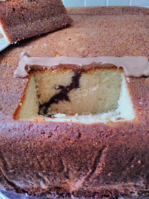 Close up of the previous image showing detail of the brown line running through the yellow cake cross section.